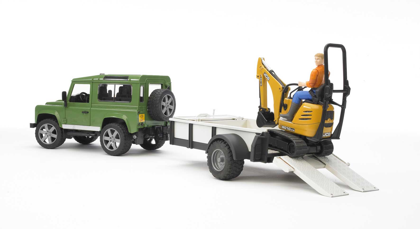 Land Rover Defender c/rim.trasp. JCB Micro escavatore con figura
